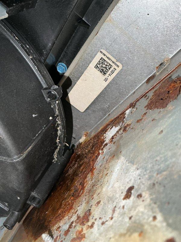 Responded to a no-heat call for an 11-year-old Lennox furnace that was disconnected from the smart hub. Diagnostic testing revealed a failed smart hub and water leakage from the inducer motor, with evidence of significant wood deterioration and metal corrosion around the mounting surface. Replaced the smart hub, inducer motor, and collector box to restore proper heating function.