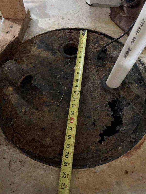 Repaired water leak at washer box by replacing damaged section of copper supply pipe that had developed a pinhole leak. Observed severely corroded sump pump cover (approximately 22-23 inches in diameter) and documented its condition with measurements for future replacement. Water supply was restored and system tested for proper operation.