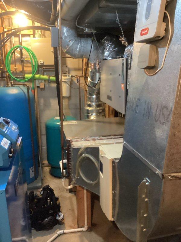 Diagnosed and resolved restricted flow issue on German Buderus boiler system with multiple loops. System was low on water, affecting garage in-floor heating; added water to restore flow and purged significant air from system. Left air vent open on manifold for continued degassing and advised customer to monitor system pressure and consider future replacement of this complex boiler system with automatic mixing valves.