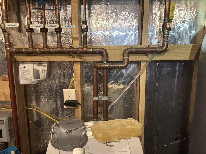 Diagnosed leaking water heater tank requiring full replacement. Identified non-functioning water softener during water testing. Customer approved installation of new 80-gallon electric water heater with mixing valve and replacement water softener; scheduled installation for Monday.