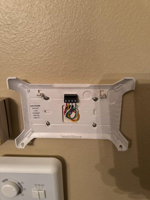 Responded to customer call reporting unresponsive thermostat with blank display. Diagnosed non-functional Armstrong Air communicating thermostat. Retrieved and installed compatible S40 replacement unit, verified proper system recognition, connected to customer's mobile device, and confirmed proper heating system operation.