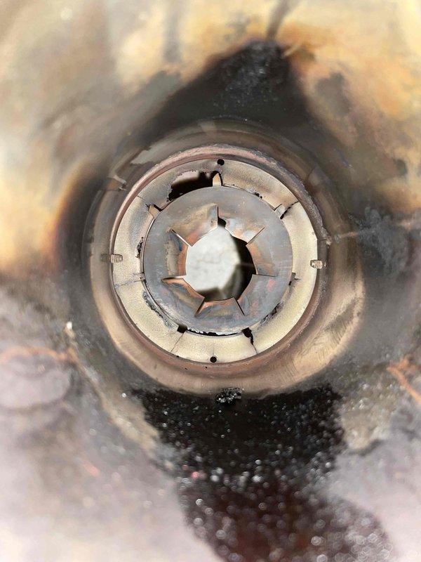 Completed annual maintenance on oil furnace per agreement. Performed standard tune-up including nozzle replacement, oil filter change, and electrode cleaning. Inspection revealed critically deteriorated burner cone with minimal structural integrity. Documented severe equipment aging with photos of compromised components. Advised customer that system is operating on borrowed time and recommended equipment replacement. Scheduled follow-up consultation for replacement options.