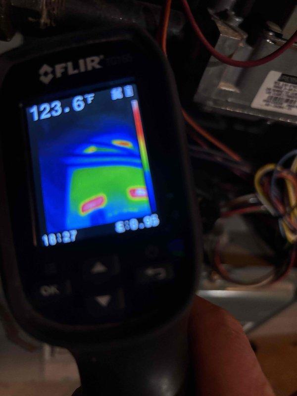 Performed scheduled furnace tune-up and diagnostic inspection. Identified inoperative inducer motor as source of no-heat condition, confirmed by voltage testing showing 120V reaching the component and thermal imaging revealing excessive heat (123.6°F). Exterior condensing unit exhibits significant dirt accumulation and vegetation encroachment. Customer opted to schedule consultation with advisor regarding repair versus replacement options.