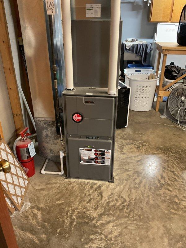 Performed routine inspection on 13-year-old Rheem forced air system at newly purchased residence. System operating normally, but identified significant dust accumulation in ductwork, particularly in hallway return grill. Discussed duct cleaning options with homeowners, who expressed interest in scheduling comprehensive cleaning service after the holidays to address airflow issues throughout the house.