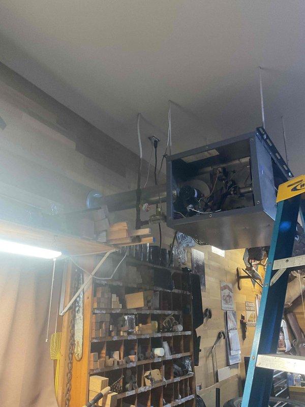 Diagnosed garage ceiling-mounted heating unit that was cycling on briefly then shutting down. Determined gas valve was malfunctioning - valve would initially open but then fail during operation. Replaced faulty gas valve to restore proper heating function.
