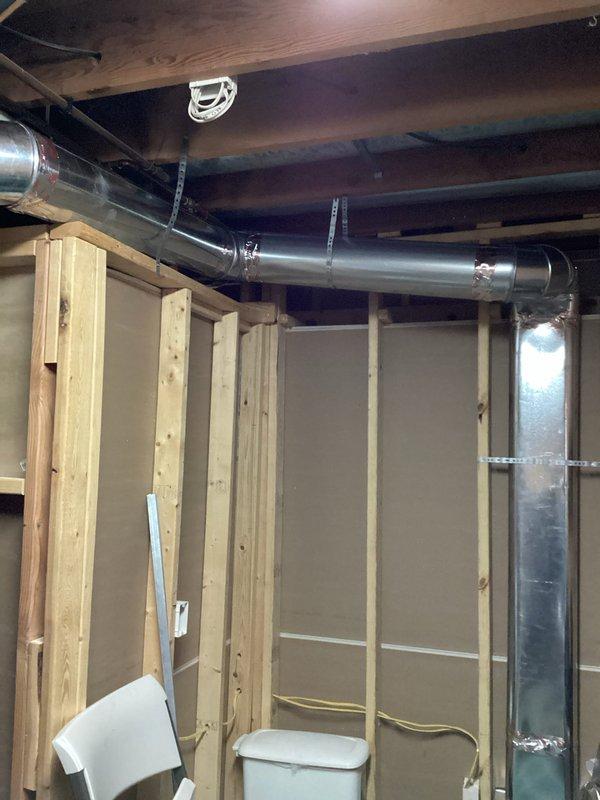 Performed warranty service visit on recently installed Lennox HVAC system to address multiple installation deficiencies. Corrected issues with unsealed fresh air intake tube, uncaulked PVC fresh air tubing, and improperly installed cold air exchange ducting. Noted that according to customer, the new supply installation did not follow agreed plan; submitted install correction form for follow-up work.