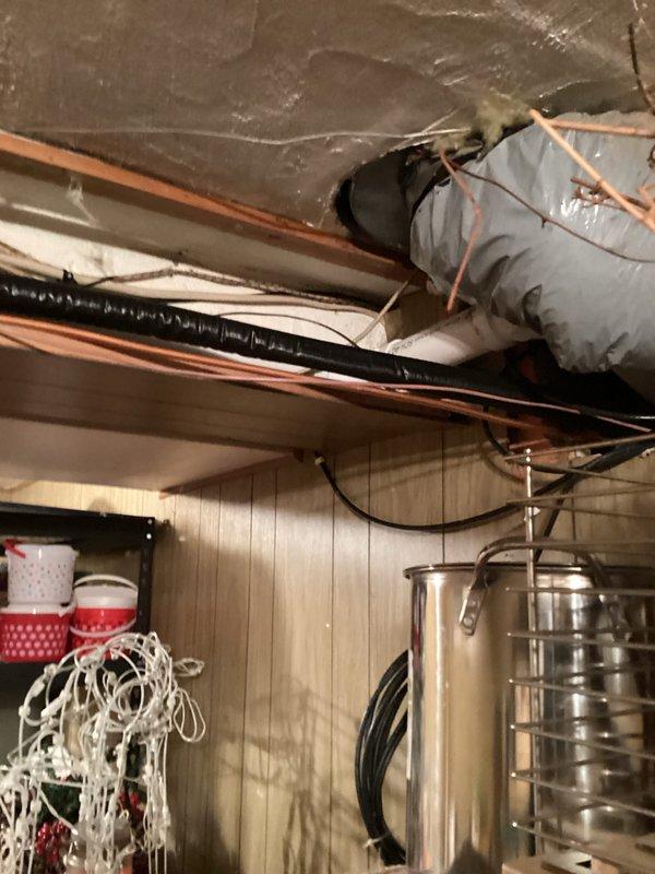 Diagnosed intermittent flame failure on recently installed Verna furnace due to pressure fluctuations in exhaust system. Identified major low spot in exhaust piping causing water accumulation, which created vacuum irregularities from the inducer motor and resulted in gas valve cycling between stages. Return visit required to re-pipe exhaust line to eliminate low spot and restore proper operation.