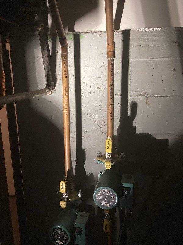 Replaced leaking water heater, relocated unit from corner position, and modified boiler loop piping to facilitate removal of old unit. Observed boiler was non-operational throughout service; scheduled follow-up visit with technician to diagnose and resolve boiler functionality issues. Documented installation with photos of plumbing infrastructure and valve assemblies for record-keeping.