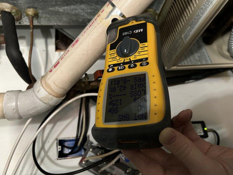 Responded to no heat call for 30+ year old electric furnace. Diagnosed faulty inducer motor producing grinding noise. Conducted electrical measurements with multimeter to verify component failure. Due to age of unit and part availability, recommended replacement. Customer opted for full system evaluation, with sales appointment scheduled.