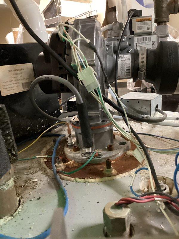 Successfully installed new inducer motor on kitchen water heater, restoring proper heating operation. During service, identified and documented a leaking spacer plate seal between heat exchanger and inducer motor. Submitted parts order form for replacement seal to complete necessary repairs.