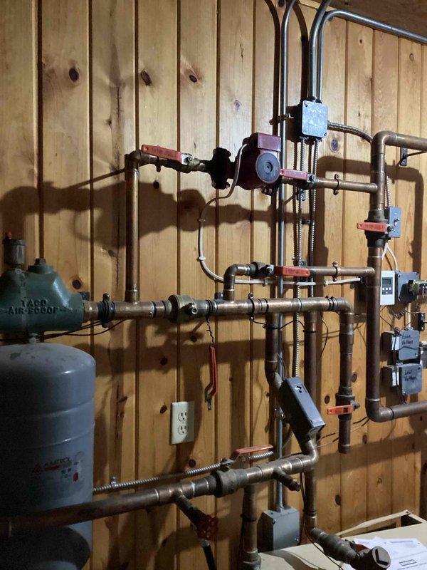 Responded to service call for non-starting boiler system in gym. Discovered low system pressure and refilled system, but unit continued to overheat. After assessment, determined potential circulation pump failure preventing proper water movement through the system. Temporarily resolved overheating by adjusting valve positions to force full system circulation, which successfully restored heating to the building. Recommended follow-up visit by senior boiler technician to conduct comprehensive diagnosis and address potential pump issues.