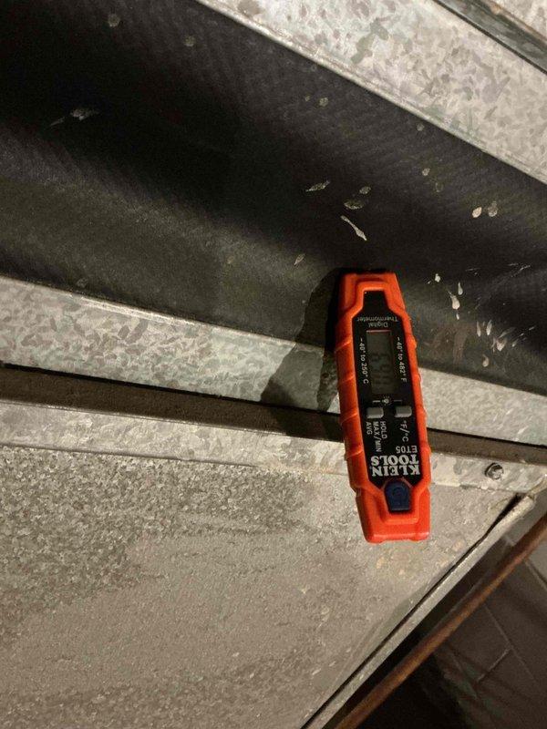 Performed diagnostic assessment on 19-year-old furnace with suspected smoke damage following a house fire. Inspection revealed smoke contamination inside front cover, potential heat exchanger crack, severely smoke-damaged condensate pan and evaporator coil, grinding draft motor, and worn flame sensor and ignitor. Documented damage with photographic evidence of electrical components and control board for insurance purposes.