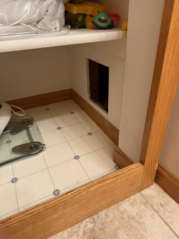 Performed inspection of reported bathroom leak affecting ceiling below. Accessed plumbing through cabinet access panel to evaluate shower valve system. Observed aged copper supply lines with visible oxidation and standard PVC drain assembly. Provided comprehensive estimate for shower valve replacement to address recurring leak issue that was previously repaired approximately three years ago.