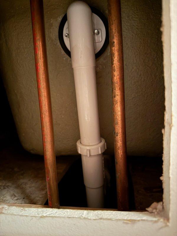 Performed inspection of reported bathroom leak affecting ceiling below. Accessed plumbing through cabinet access panel to evaluate shower valve system. Observed aged copper supply lines with visible oxidation and standard PVC drain assembly. Provided comprehensive estimate for shower valve replacement to address recurring leak issue that was previously repaired approximately three years ago.