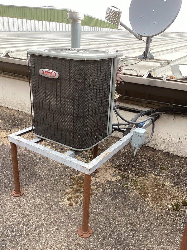 Responded to no-cooling complaint in server room with two malfunctioning units. Diagnosed ceiling cassette unit with failed contactor requiring specialized replacement part. Second system (Lennox split unit) found completely depleted of refrigerant with damaged condenser coil at bottom. Ordered replacement contactor for cassette unit and requested service advisor to quote replacement of the damaged split system.