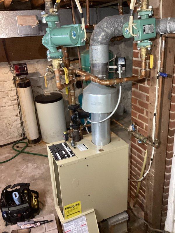 Diagnosed issue with no heat complaint in aging HVAC system; determined problem was caused by faulty connection in damper assembly. During troubleshooting and wire tracing, damper began functioning properly. Monitored system operation for approximately 30 minutes to confirm proper heating throughout the residence, verifying radiator function on both floors. Although temporarily operational, submitted request for replacement damper assembly due to intermittent nature of the connection issue.