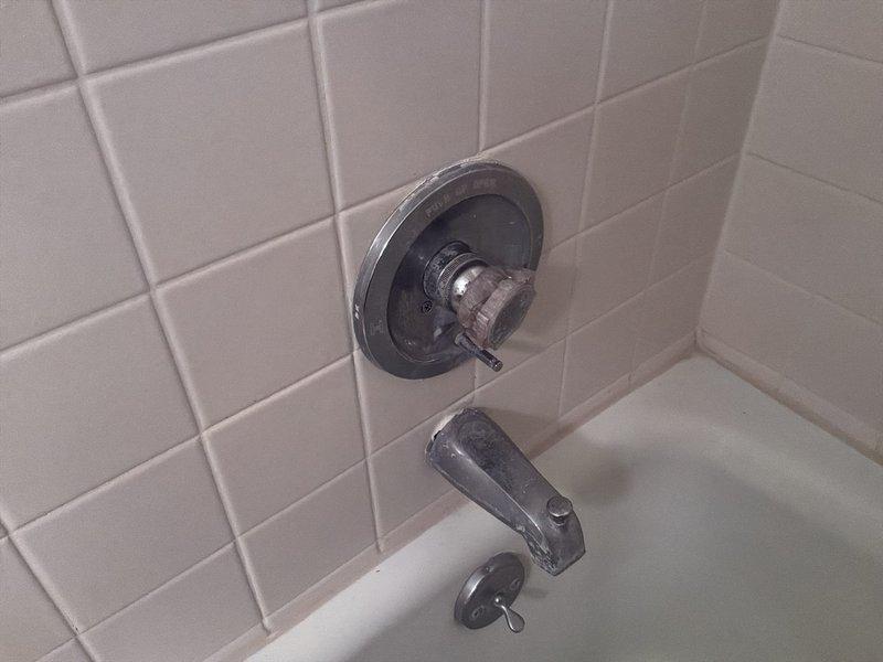 Inspected customer-supplied Delta faucet rebuild kit for tub/shower fixture with active leak. Evaluated plumbing system, noting non-functional water shut-off valve. Provided customer with multiple repair options including rebuilding existing faucet, complete faucet replacement, and installation of new shut-off valves with pressure tank. Customer will contact us to proceed with their chosen option.