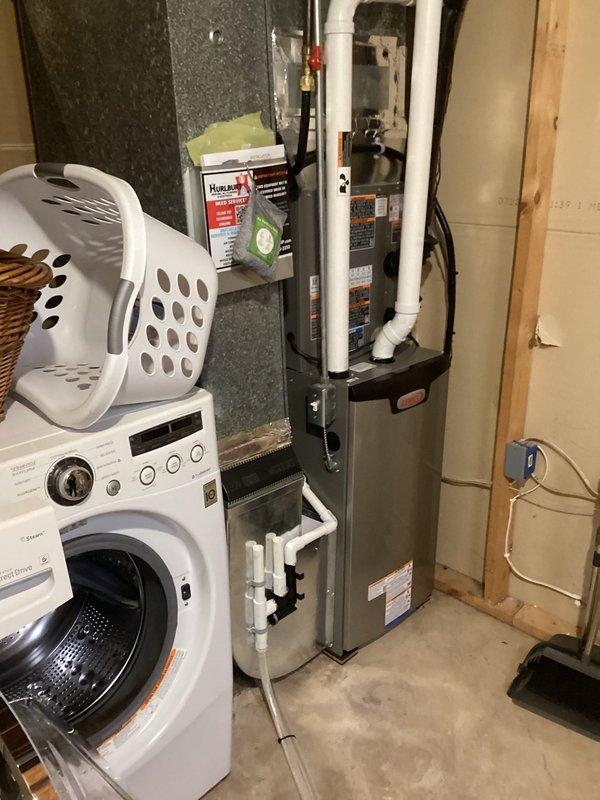 Responded to no heat complaint on recently installed unit. Diagnosed low pressure lockout due to pressure switch failure (error code 255). Determined water accumulation in exhaust venting crossing over finished ceiling and under four seasons room is preventing proper operation of second stage heating. Temporary repairs unsuccessful; recommended return visit with additional assistance to access and re-pitch exhaust pipe requiring removal of plywood sheeting from floor outside the four seasons room.