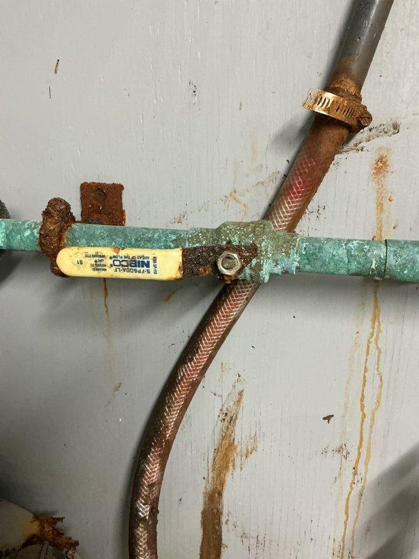 Responded to service call for leaking RPZ valve located in the chemical room. Upon inspection, found RPZ valve actively leaking with significant wall staining evident. Attempted to disassemble the valve for service but components could not be separated due to corrosion. Also identified a secondary issue with the atmospheric vent on the same line in another part of the room which was also leaking. Submitted comprehensive estimate for necessary repairs to both affected components.