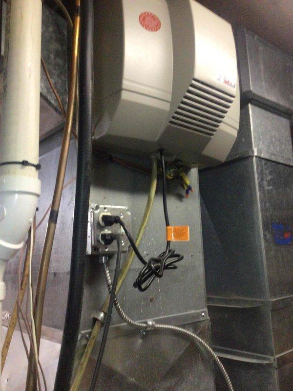 Performed diagnostic on 16-year-old heating system that was blowing cold air intermittently after resets. Inspection revealed improper combustion and upon removal of blower assembly, discovered water accumulation, darkening, evidence of rodent intrusion, and completely failed secondary heat exchanger. Equipment was tagged unsafe for operation and replacement options were provided to customer.