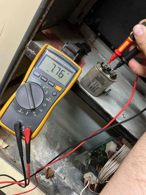 Performed routine inspection and maintenance on 21-year-old furnace as part of bi-annual service agreement. Testing revealed several aging components including weakening igniter, deteriorating flame sensor, and draft motor exhibiting chirping noise indicating imminent bearing failure. Observed early-stage heat exchanger deterioration with formation of pinholes, though no complete penetration detected that would require immediate decommissioning. Electrical diagnostics confirmed component resistance values were within operational parameters. Discussed replacement options with homeowners.