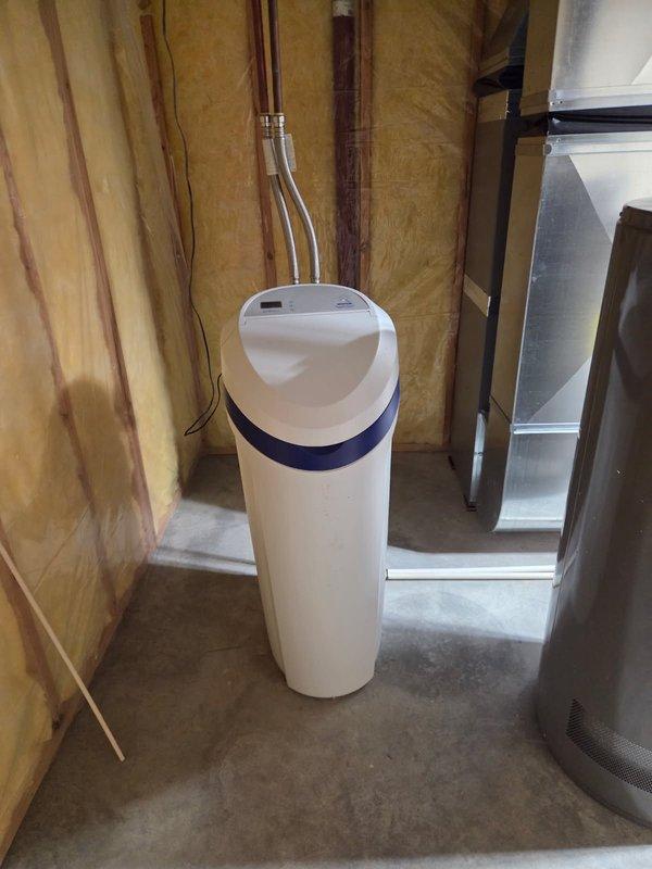 Inspected Morton System Saver water softener that was not using salt due to salt bridge formation. Broke up salt bridge, cleaned brine tank, and performed system reset. Unit now functioning properly with normal salt consumption resumed.