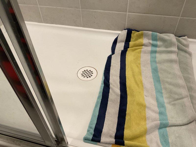 Responded to customer complaint of sewer gas odor emanating from master shower drain. Conducted thorough inspection and testing of all bathroom fixtures but was unable to detect any sewer odor at time of service. Noted customer had previously used vinegar and baking soda treatment in the drain, which was the only detectable scent during inspection.