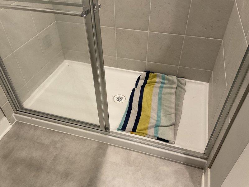 Responded to customer complaint of sewer gas odor emanating from master shower drain. Conducted thorough inspection and testing of all bathroom fixtures but was unable to detect any sewer odor at time of service. Noted customer had previously used vinegar and baking soda treatment in the drain, which was the only detectable scent during inspection.