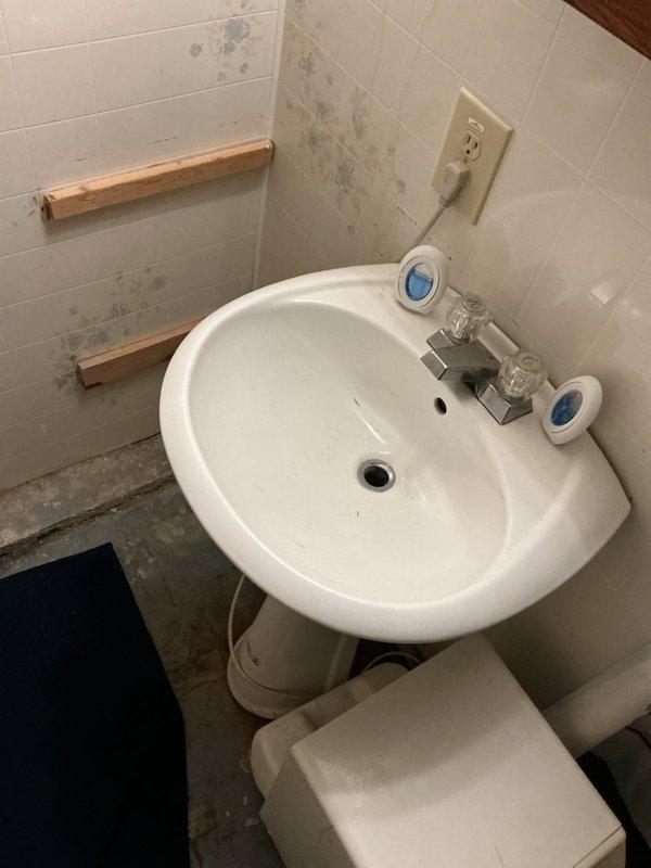 Responded to service call for a reported upstairs bathroom leak. Upon inspection, determined the toilet was the likely source of leakage. Removed toilet, replaced worn wax ring, and identified possible need for flange replacement. Documented additional plumbing issues with bathtub and sink areas showing signs of water damage and deterioration; left estimates for recommended repairs.