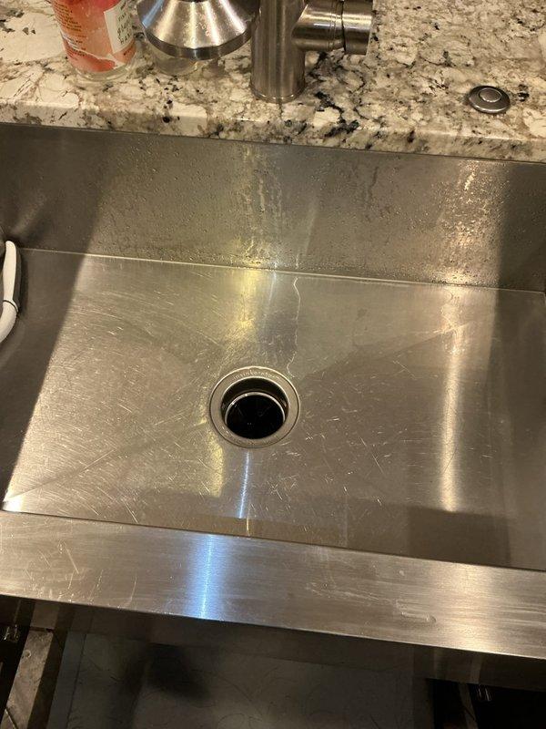 Arrived to address humming garbage disposal. Diagnosed jammed unit causing operational noise. Successfully cleared obstruction and restored proper functionality of disposal.