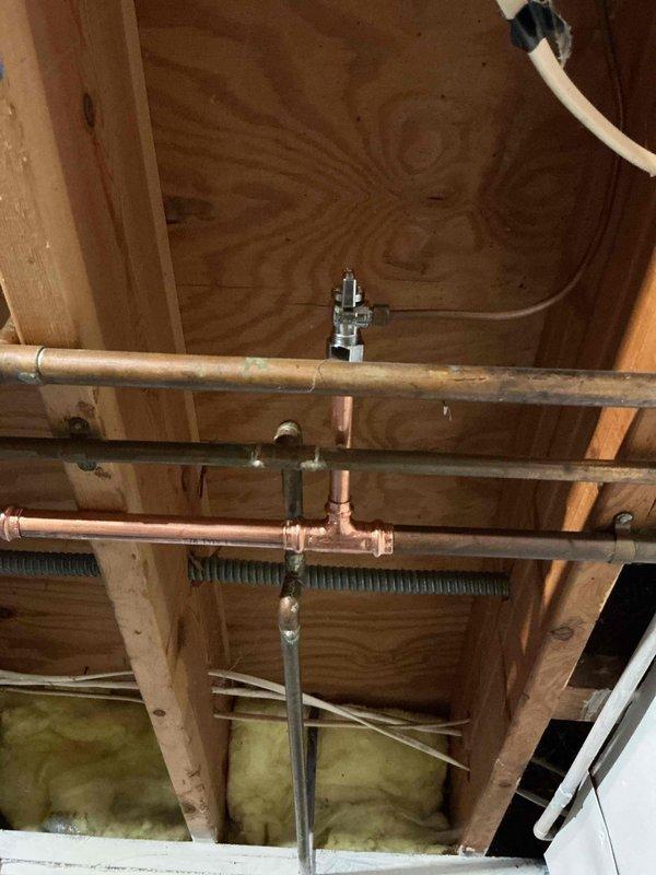 Disconnected water line from old refrigerator and reconnected to new unit. Upon inspection, identified failing saddle valve requiring replacement. Successfully installed new valve assembly and verified proper connection of copper water line to ensure reliable water supply to customer's refrigerator.