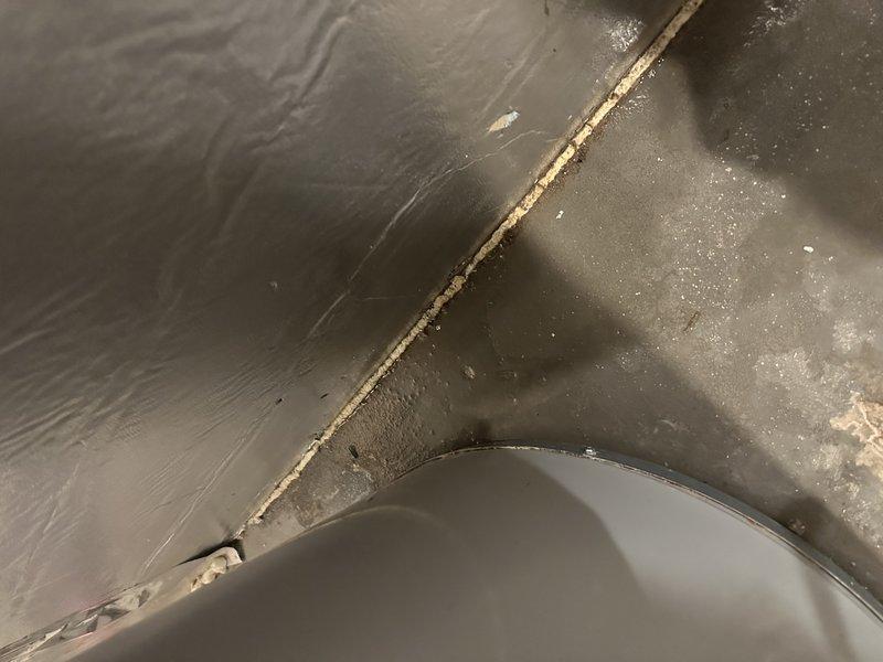 Responded to a service call for a leaking water heater with water escaping from the bottom rear of the unit. Upon inspection, determined the 10-year-old unit had a cracked tank causing the leak. Replaced with new Bradford White 50-gallon natural gas power vented water heater and installed expansion tank. Customer has Family Rewards membership.