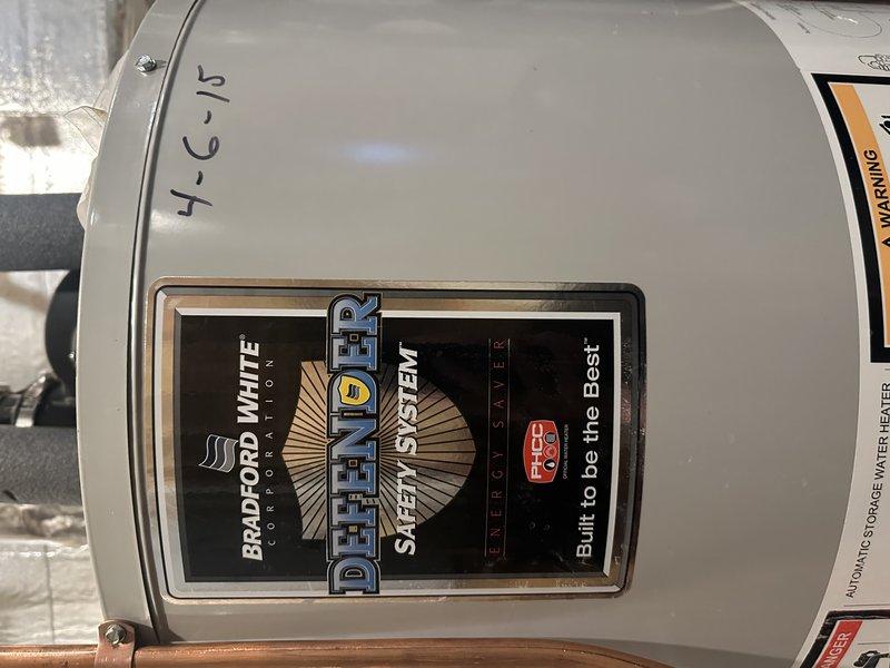 Responded to a service call for a leaking water heater with water escaping from the bottom rear of the unit. Upon inspection, determined the 10-year-old unit had a cracked tank causing the leak. Replaced with new Bradford White 50-gallon natural gas power vented water heater and installed expansion tank. Customer has Family Rewards membership.