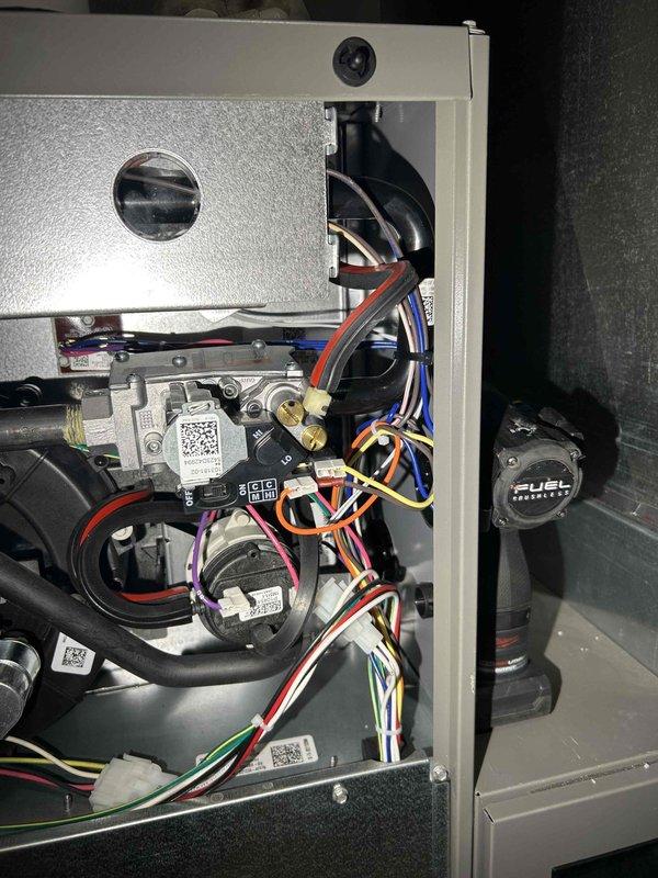 Conducted comprehensive furnace tune-up on FR unit, addressing several maintenance items. Adjusted gas train pressure from 3.12 inWC to 3.46 inWC and set LO stage to 1.56 inWC. Cleared condensate drain line and trap of spider webbing and debris, verified proper operation of inducer motor, capacitor, pressure switch, control board connections, and thermostat operation. Noted extremely dirty return air filter requiring replacement; combustion CO recorded at 11 ppm, which is within acceptable range.
