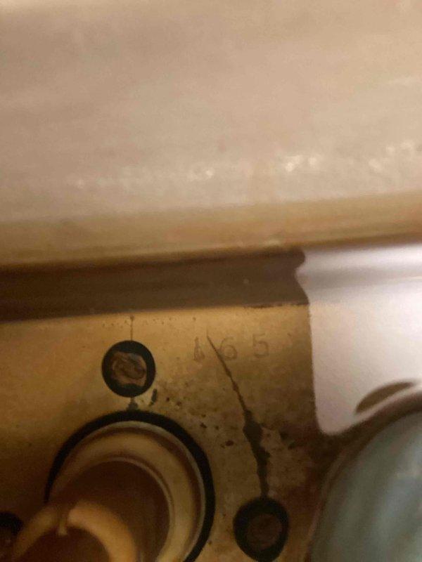 Responded to service call for a leaking toilet. Diagnosed crack in the tank causing water leakage. Removed damaged unit and installed new short round toilet. Verified proper operation and water-tight seal after installation.