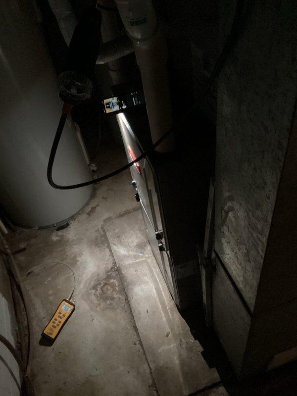 Performed furnace tune-up on approximately 8-year-old natural gas unit following customer report of gas odor from exhaust during startup. Comprehensive inspection confirmed unit is operating safely with no internal gas leaks. Verified proper function of ignitor and flame sensor, and confirmed gas pressure within acceptable range. Combustion analysis performed with Testo 310 analyzer showing excellent efficiency (96.2%) with safe CO levels (11 ppm).