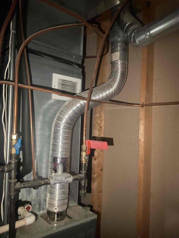 Performed routine maintenance tune-up on 21-year-old forced air system. System was operational with no functional issues noted. Replaced existing flexible exhaust duct with recommended hard pipe ducting to improve efficiency and safety. Inspected electrical connections and verified proper wiring at circuit board terminals.