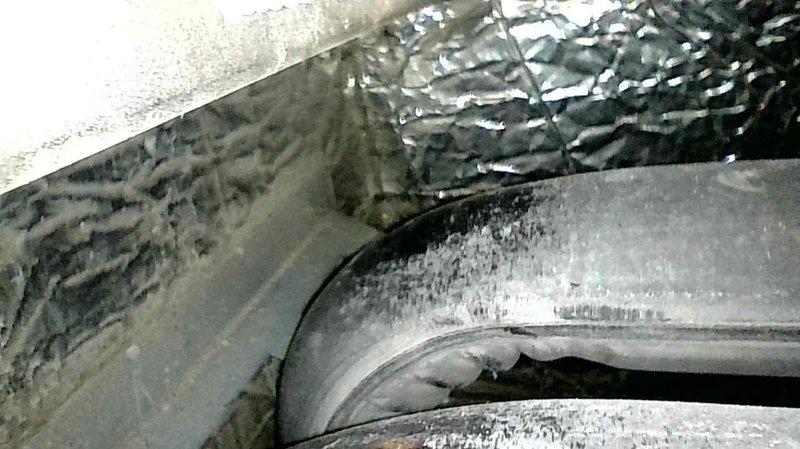 Responded to service call regarding noise from furnace during startup. Investigation revealed paper wrapper had been drawn into blower assembly. Removed obstruction, replaced air filter, and performed operational check to verify proper function. Completed furnace tune-up per customer request.