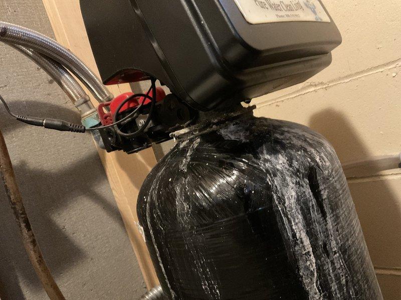 Responded to service call for hybrid water heater showing ECC error code (heat pump fault). Customer reported insufficient hot water for walk-in tub. Reset water heater and tested operation by running hot water until heater activated. Monitored system for 30 minutes, confirming normal operation with temperature reading of 149°. Provided customer with instructions to monitor for recurrence of error code or performance issues.