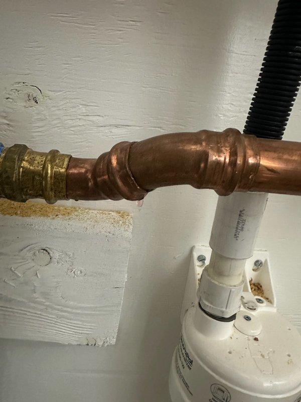 Responded to warranty service call for recently installed boiler (5 months old) exhibiting glycol leak at a pro press fitting on copper pipe. Identified drip at connection point in plumbing network. Operated unit and adjusted temperature settings to manufacturer specifications for in-floor heating system.