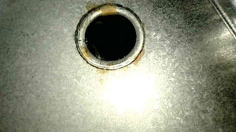 Conducted routine maintenance on 7-year-old LP Lennox furnace, including cleaning flame sensor, verifying proper condensate drainage, and inspecting heat exchanger. System started properly with 50° temperature rise; noted recently replaced burners (4-5 years ago) were clean and all electrical components checked out during inspection. Visual examination revealed some deterioration of pipe surface and potential corrosion around heat exchanger opening.