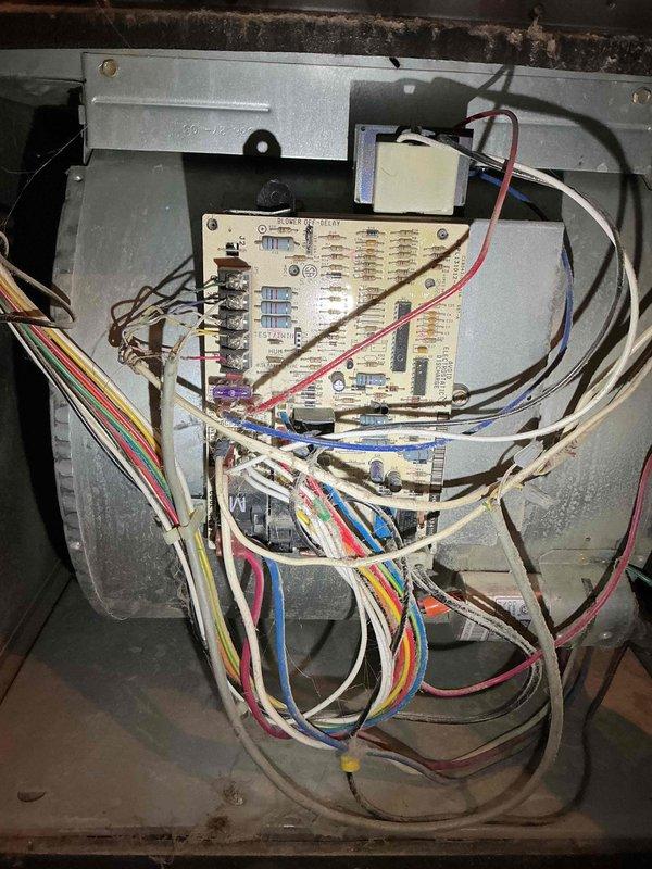 Responded to no heat call for 12-year-old Payne PG8MAA048110 furnace displaying error code. Diagnosed failed and seized draft motor causing pressure switch fault. Inspection revealed deteriorating heat exchanger with rust at factory crimp and signs of excessive temperature stress. Blower wheel showed dust accumulation. Control board and wiring appear functional but system non-operational due to draft motor failure and heat exchanger concerns. Customer consulting home warranty company regarding repair options.