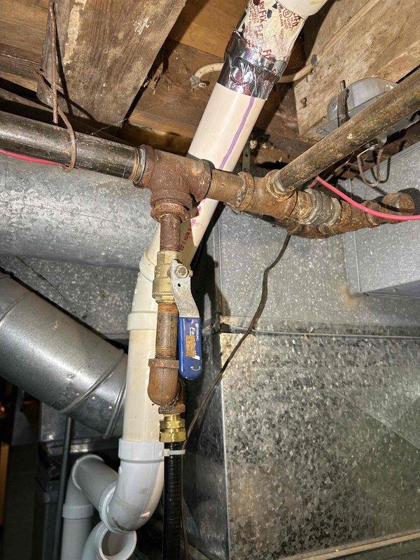 Performed comprehensive furnace tune-up service including correction of gas train pressure from 3.671 inWC to 3.30 inWC and clearing of condensate drain line and trap that contained accumulated spiderwebbing and debris. Verified proper operation of all critical components (inducer motor, capacitor, pressure switch, control board connections, and thermostat), confirmed moderate condition of return air filter, and documented combustion CO at 18 ppm, with furnace now operating normally with no immediate concerns.