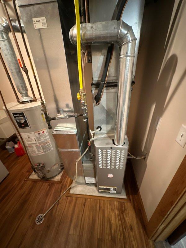 Performed a furnace tune-up on residential system. During heat exchanger inspection, discovered a significant 2-3 inch crack in one combustion chamber. Detected rising carbon monoxide levels with increased temperature operation. Informed customer that heat exchanger replacement or full furnace replacement is required.