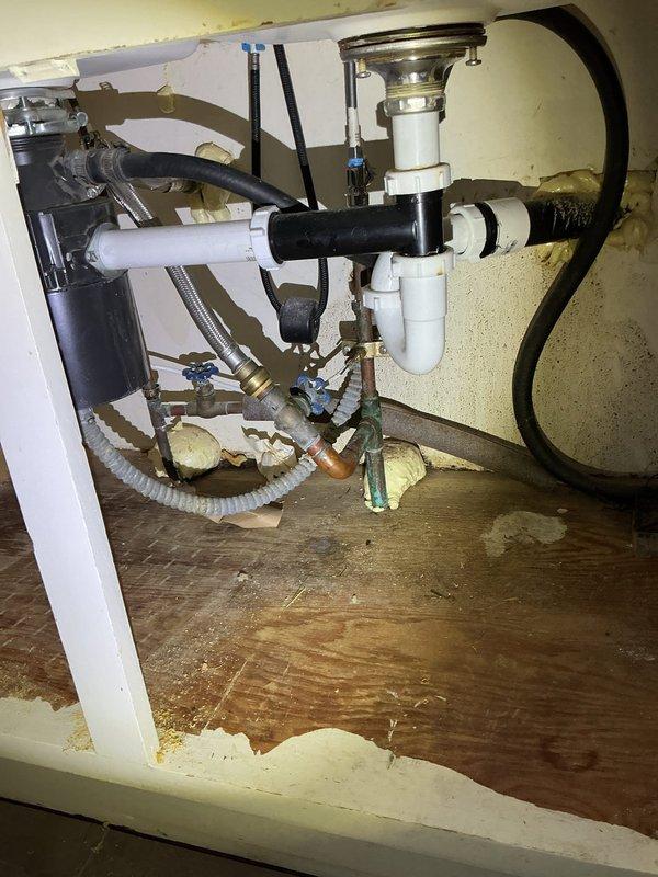Responded to water leak service call. Diagnosed disconnected ice maker line causing water damage. Replaced three shut-off valves under sink and installed new ice maker supply line to resolve the issue.