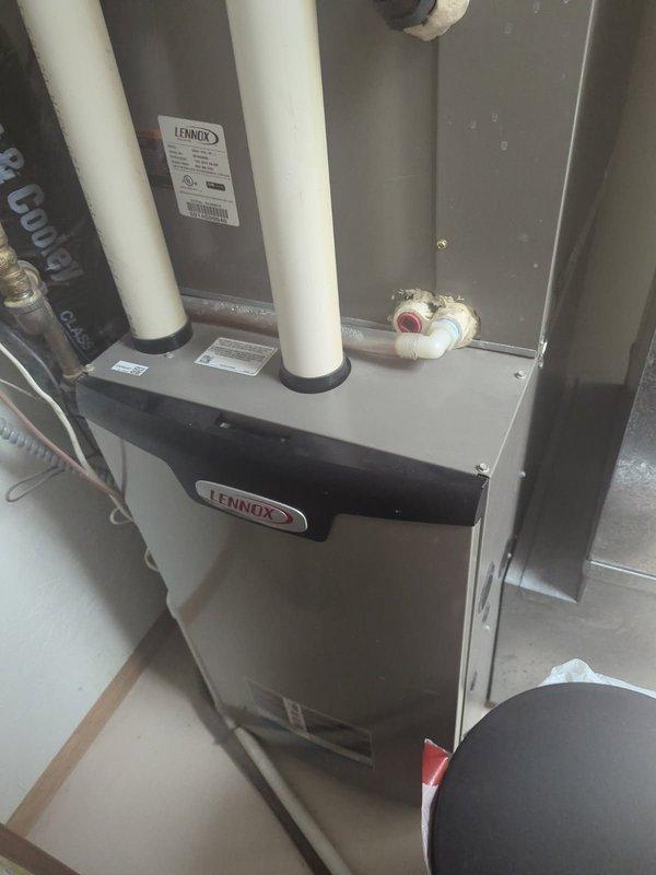 Performed comprehensive furnace inspection and maintenance service on Lennox system as requested by new homeowner following home inspector recommendation. Verified proper installation of furnace unit including intake/exhaust venting, drainage system, and electrical connections. Confirmed exterior condenser unit positioning and connections are in good working order.