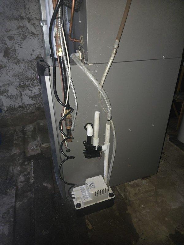 Performed warranty service to replace failed condensate pump on customer's HVAC system. Diagnosed float mechanism failure in original pump and installed replacement unit to restore proper condensate drainage function.