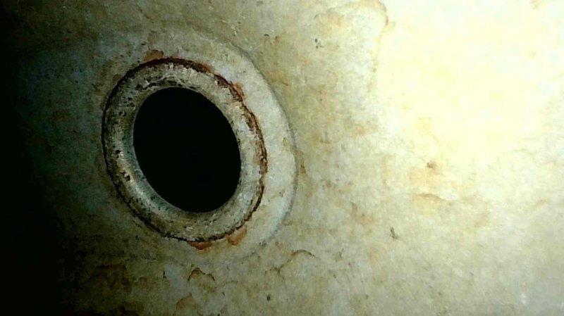 Diagnosed and condemned furnace due to cracked heat exchanger discovered during no-heat service call. Visual inspection revealed significant corrosion and oxidation inside heat exchanger. Unit was tagged out of service and recommended replacement due to advanced age of system and safety concerns.