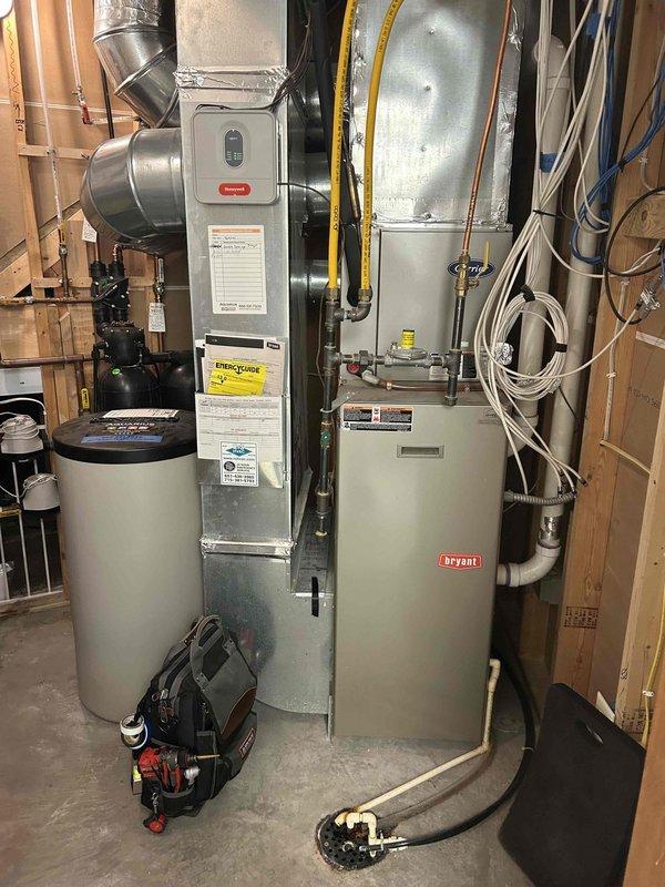 Performed annual furnace tune-up on 10+ year old natural gas Bryant furnace. Adjusted gas train pressure from 3.72 inWC to 3.47 inWC, cleaned condensate drain line and trap that contained spider webs and debris. Combustion testing showed CO at 7 ppm. Verified proper operation of inducer motor, capacitor, pressure switch, control board connections, and thermostat. Filter in moderate condition. System is operating within normal parameters with no immediate concerns.
