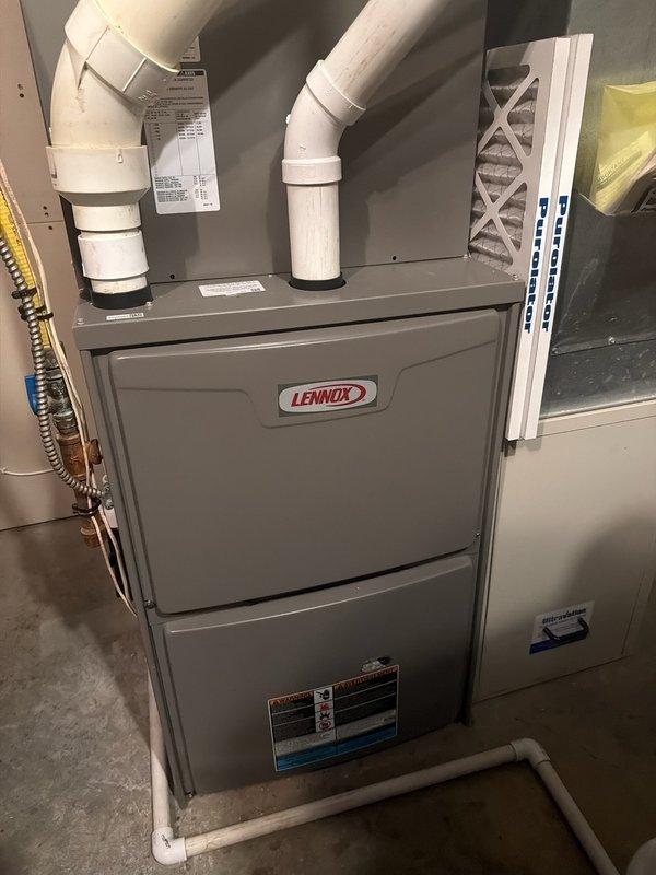 Responded to wood boiler system operating issue with zones not shutting off at temperature. Diagnosed wood stove lockout and reset unit to restore operation. Examined pump functionality throughout system and replaced garage pump as troubleshooting measure. Identified design issue causing continuous flow through hot water coil loop even when pump is inactive. Recommended installation of relay-in-a-box (RIB) to allow proper thermostat control of blower and pump to eliminate persistent heat problem.
